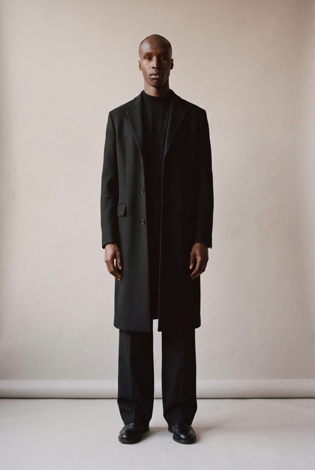 Kagiso Molefe, full length in an all-black look