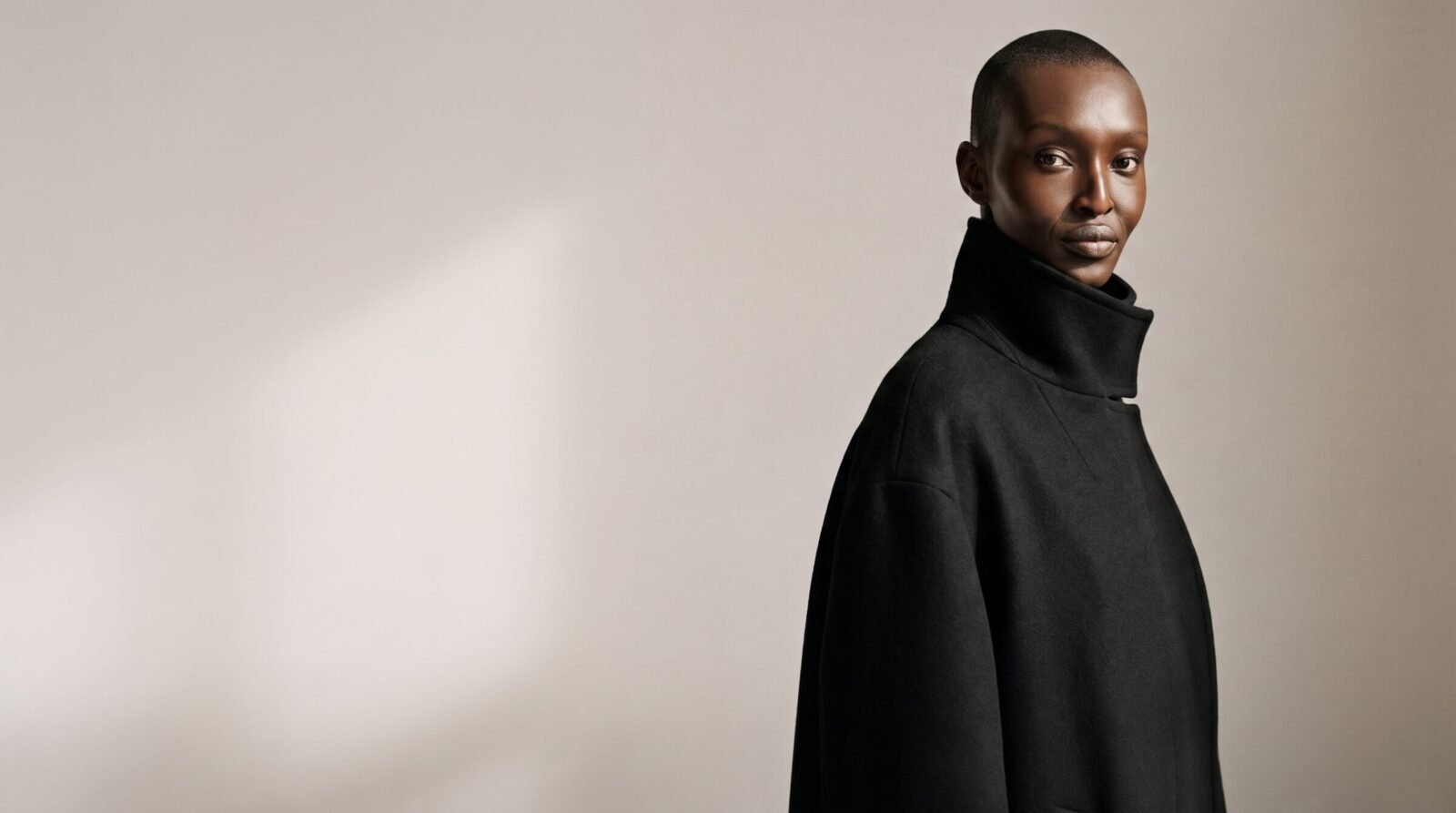 Naledi Mokoena in a black high-collar coat