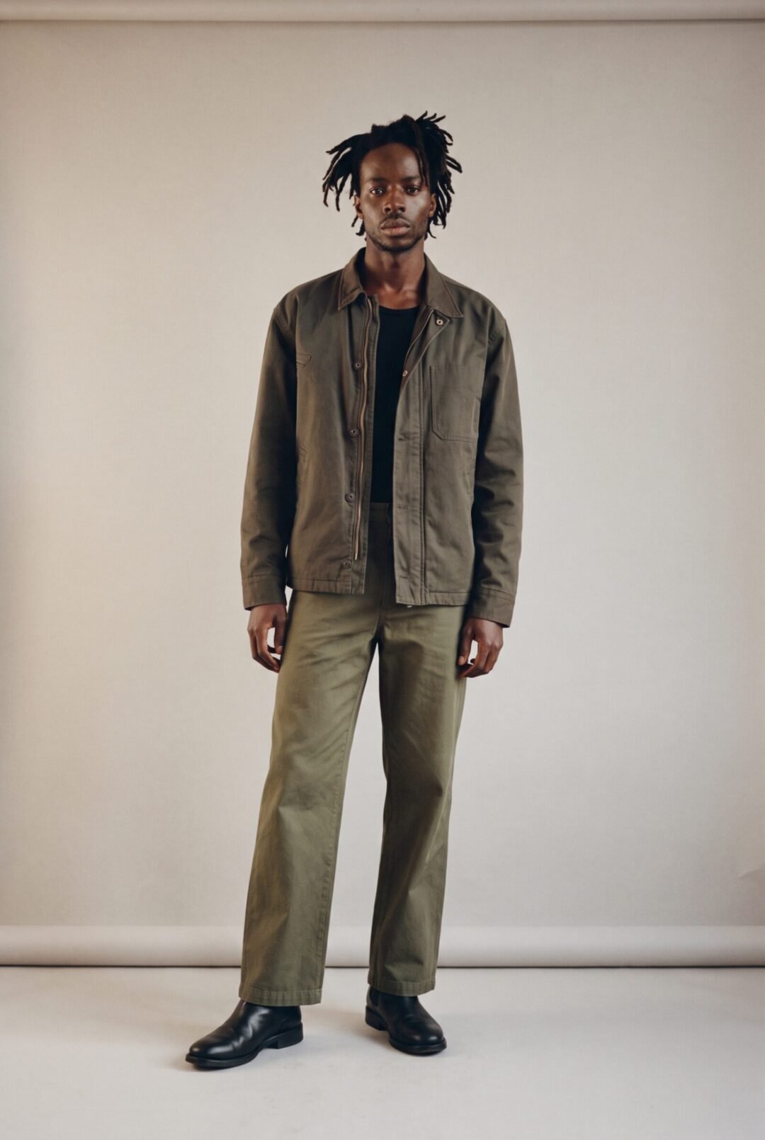 Sipho Zulu, full length in an olive work jacket